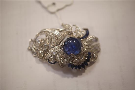 A modern ornate white gold and platinum, sapphire and diamond set clip brooch, 64mm.